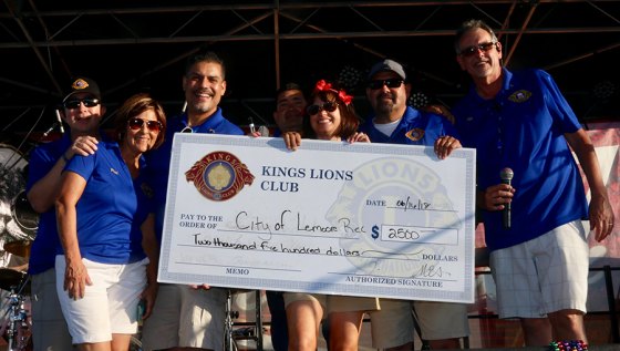 The Kings Lions Club routinely gives back to the community. Here, club members award a check to the City of Lemoore during the 2018 Brewfest.